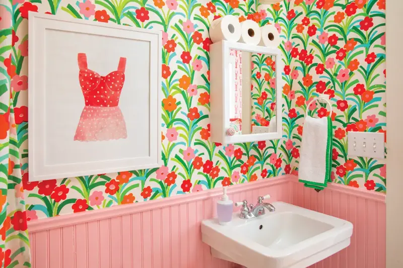 bathroom with floral wallpaper and pink beadboard