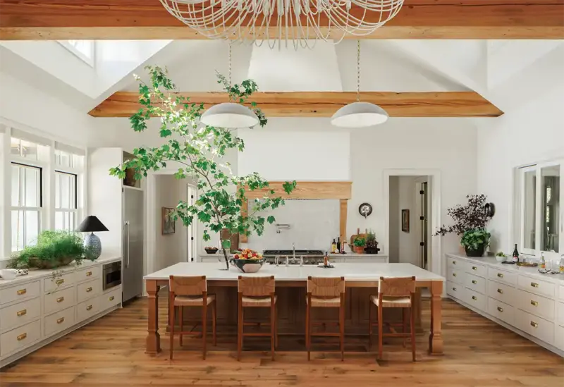 wide angle view of Mallard House kitchen with built-in hood and exposed wood beam