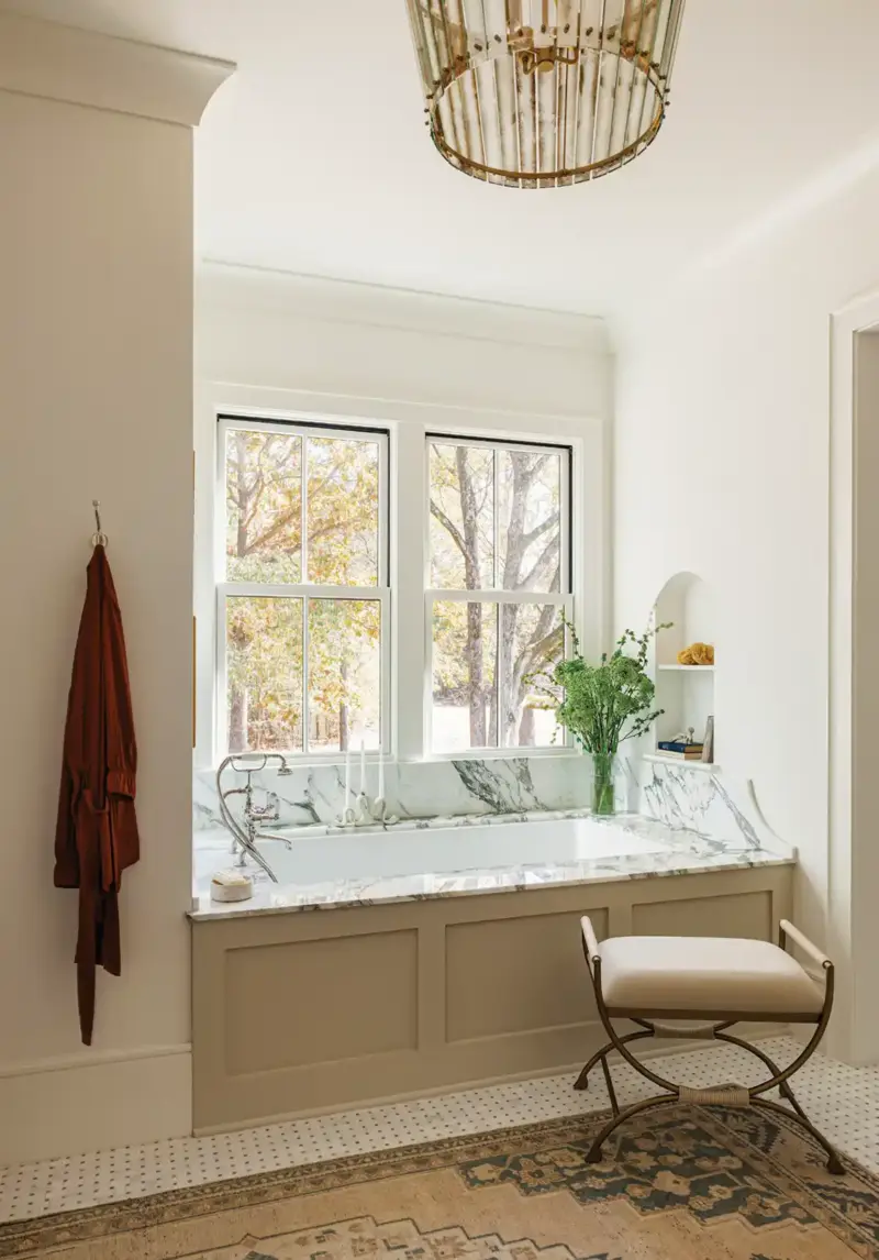 built-in soaking tub with view to trees in Mallard House