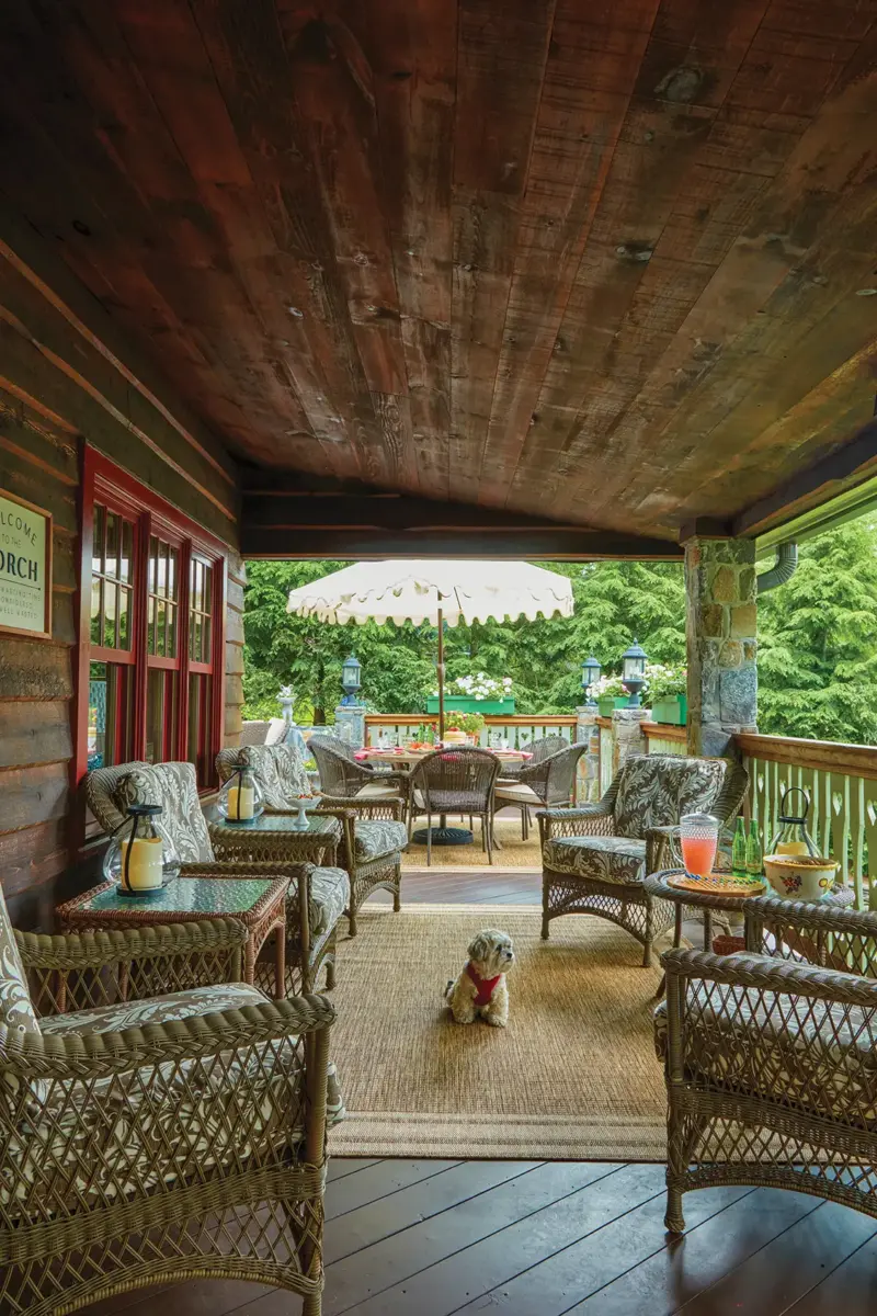 covered deck with outdoor wicker furniture and jute rug