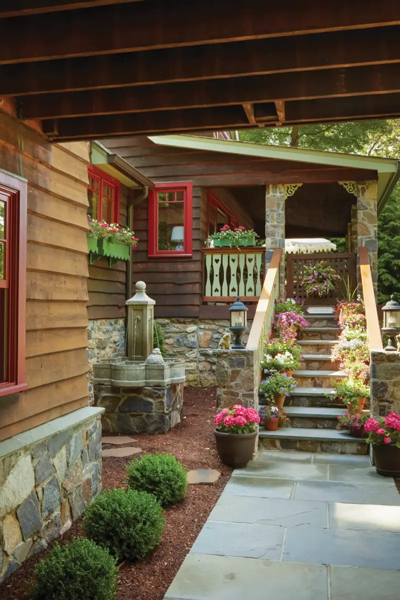 exterior of 1939 cottage with cedar siding and red trim
