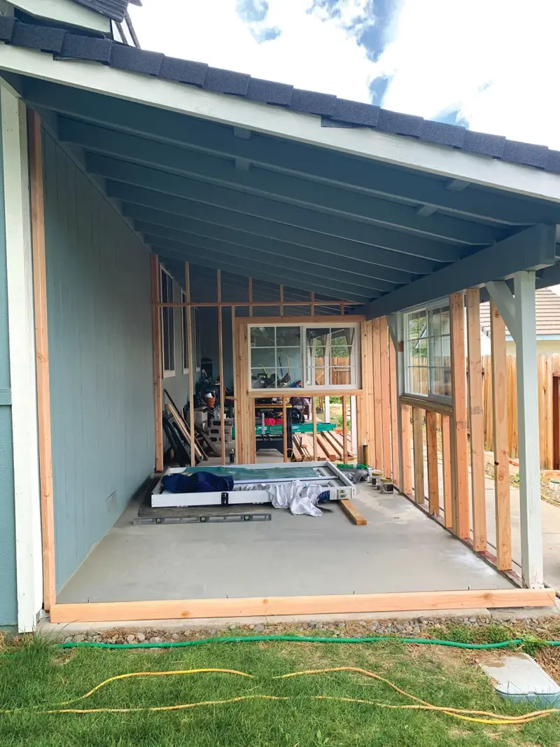 construction of hidden she shed under the eaves of the house