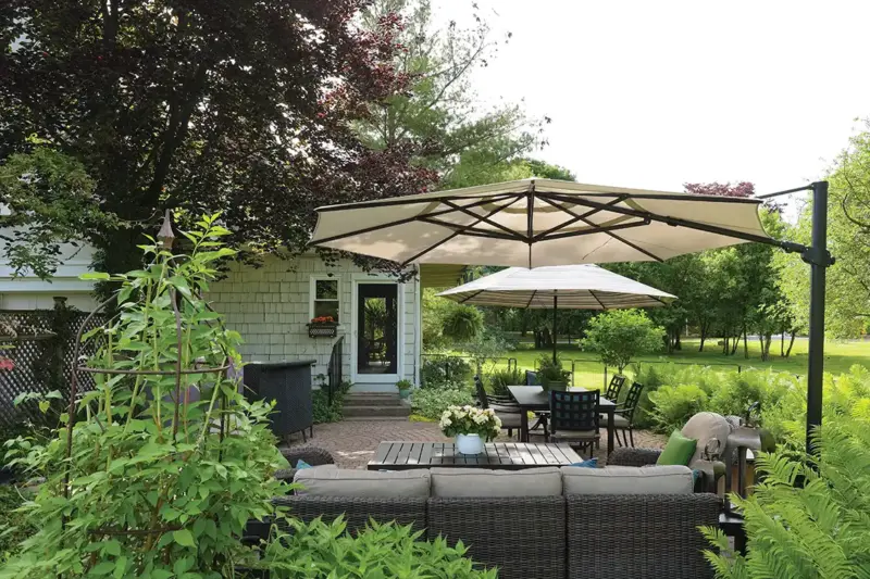 patio with outdoor sectional, dining area covered with umbrellas