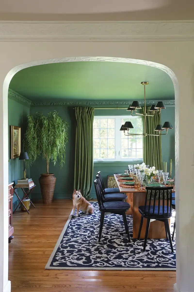 pet dog in green dining room of 1926 Tudor home refresh