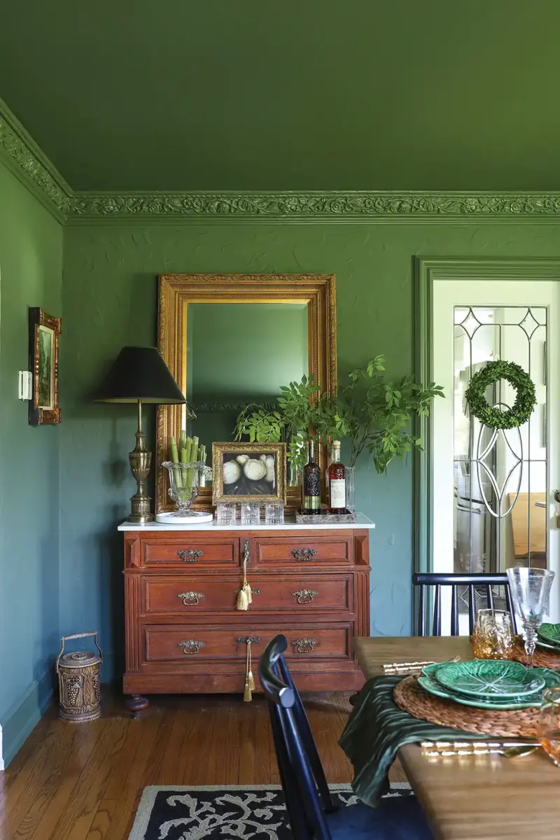 hutch in green dining room of refreshed 1926 Tudor home