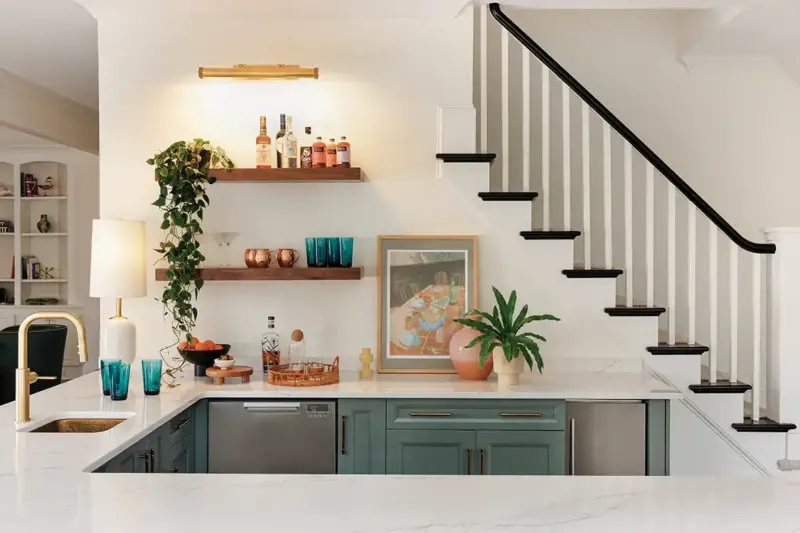 basement bar with open shelving and blue and pink details